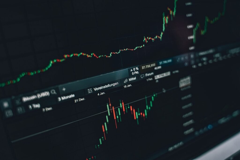Close-up of a digital market analysis display showing Bitcoin and cryptocurrency price trends.
